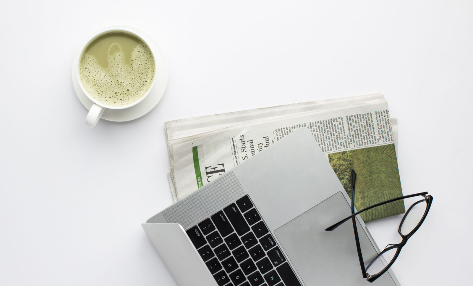 Photo of Computer with business papers & matcha tea